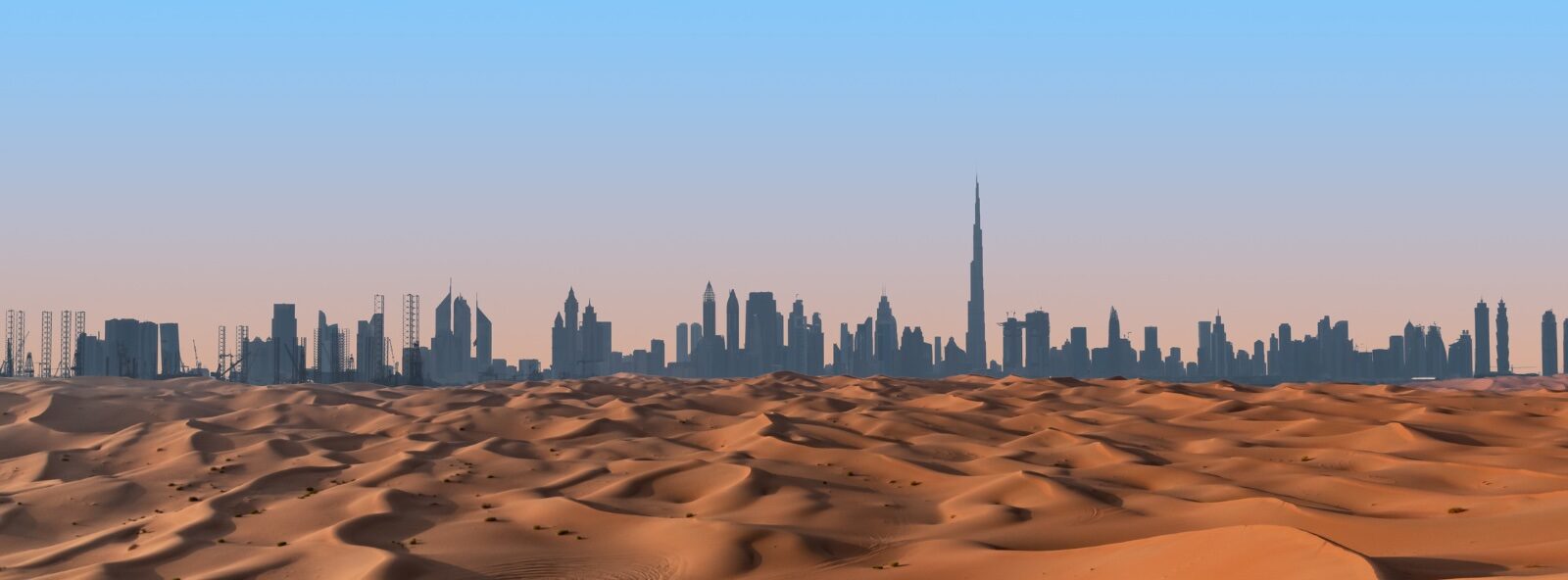 Dubai skyline and desert landscape.