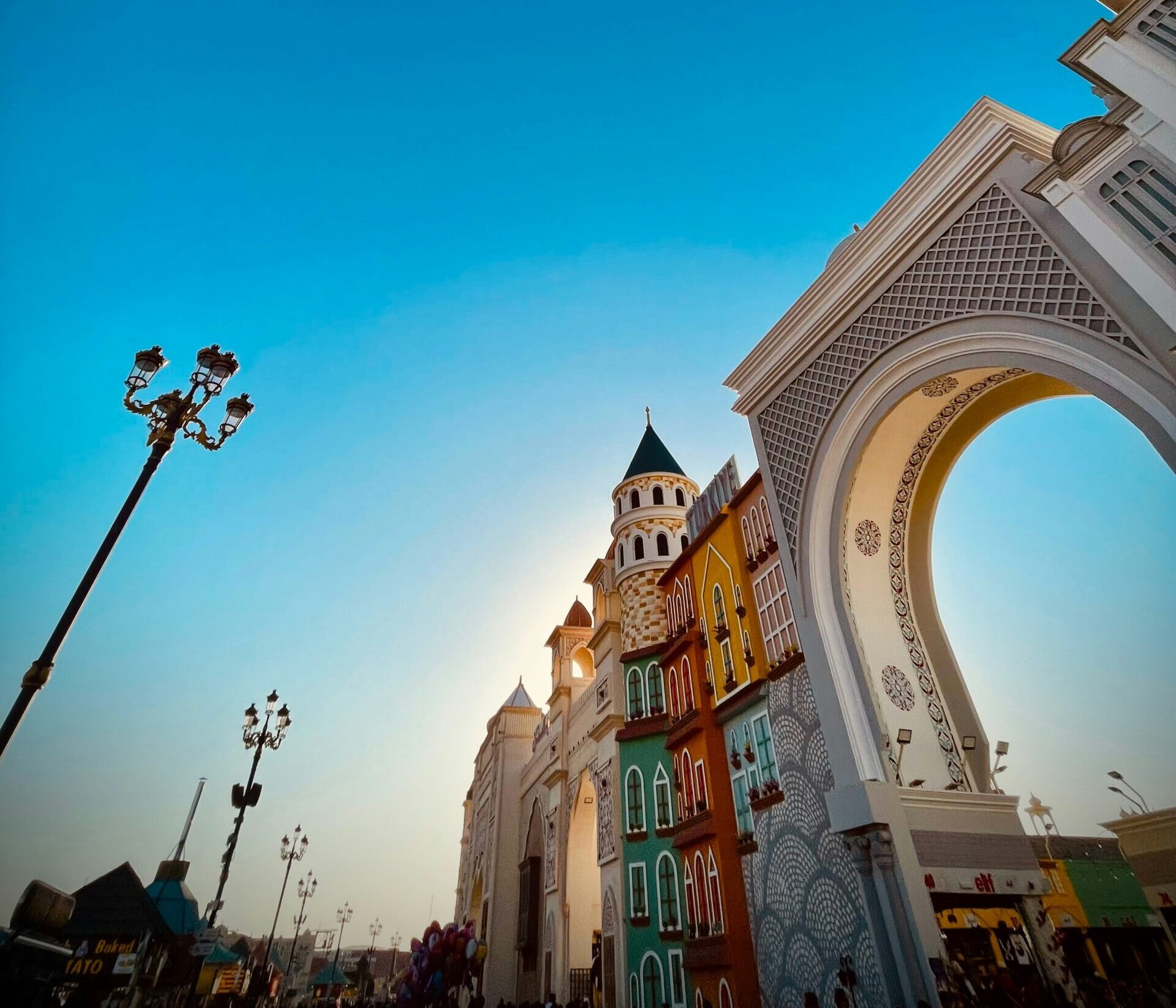 Colorful buildings and light shows at Global Village Dubai, a cultural attraction