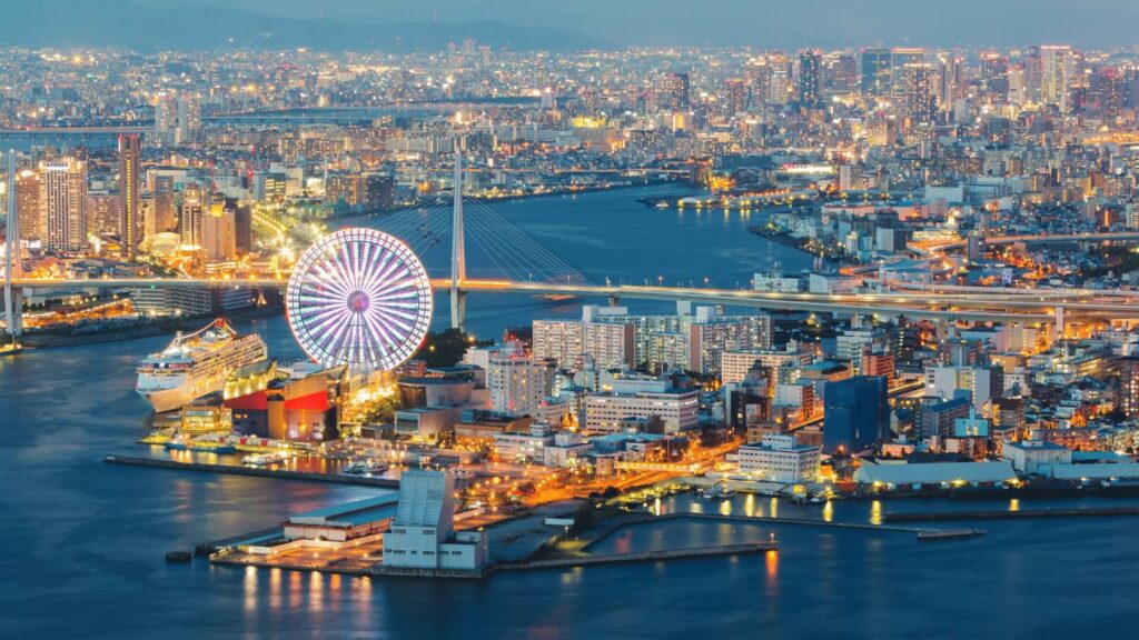 View of Osaka Ferris wheel and river bridge during vacation Japan