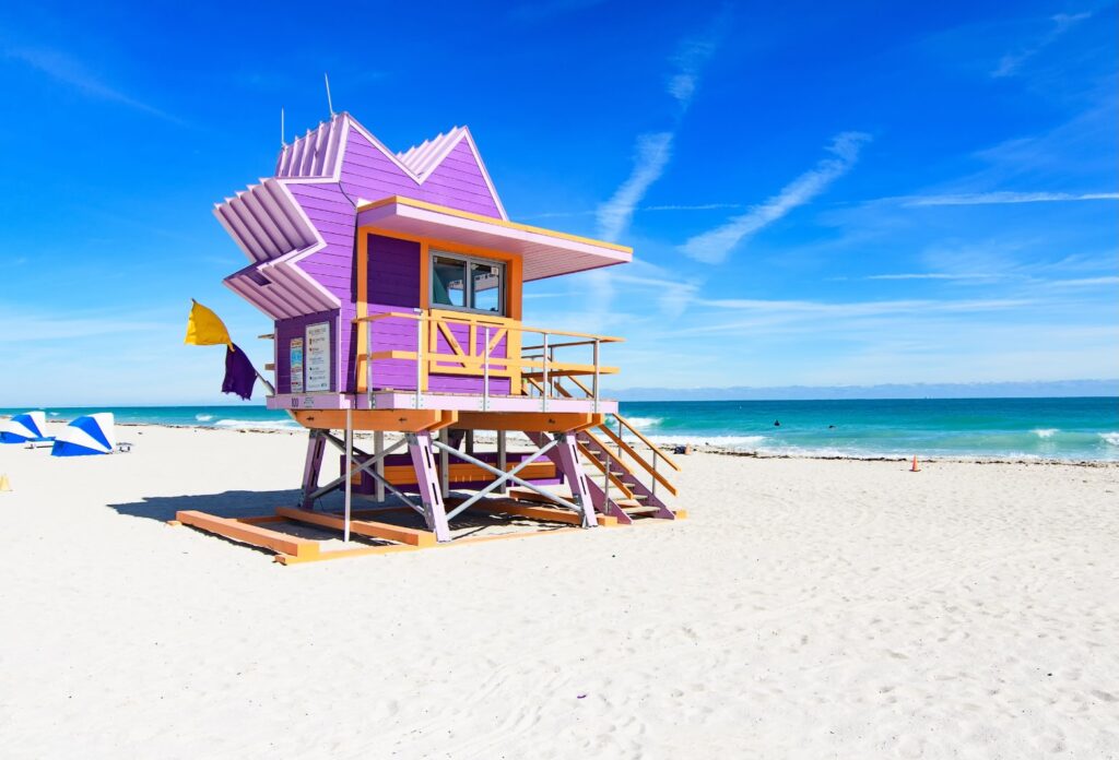 Colored lifeguard house on beach in Miami, Florida with sea view