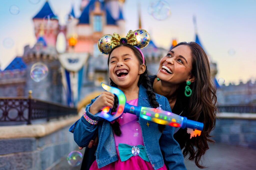 Smiling faces with Disney Castle in the background Anaheim