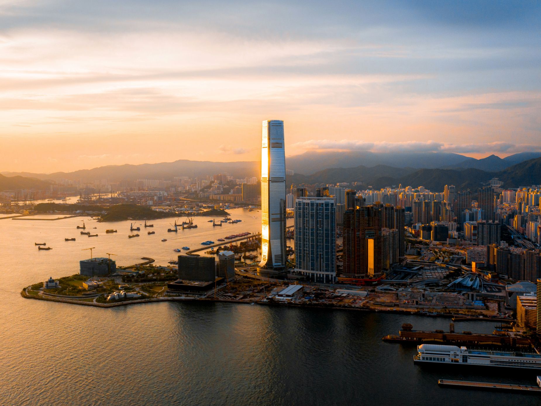 Victoria Harbour with sunset during your tour of Asia